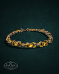 My Store vintage-inspired gold link bracelet featuring marquise-cut yellow citrine-style stones and clear accents.