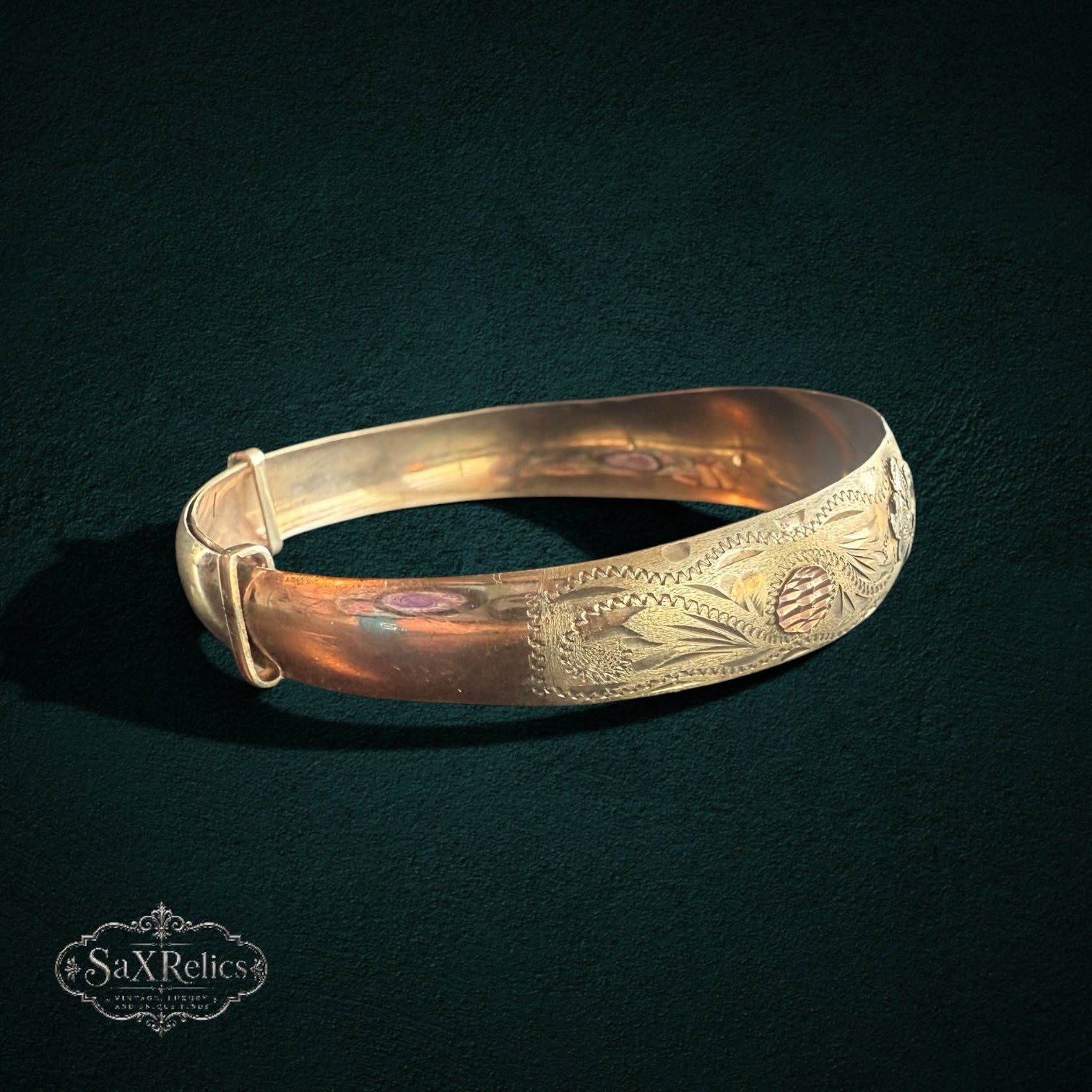 My Store vintage gold expandable bangle bracelet with intricate floral engravings and multi-tone scrollwork detail.