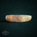 My Store vintage gold expandable bangle bracelet featuring intricate hand-engraved floral motifs and delicate scrollwork.