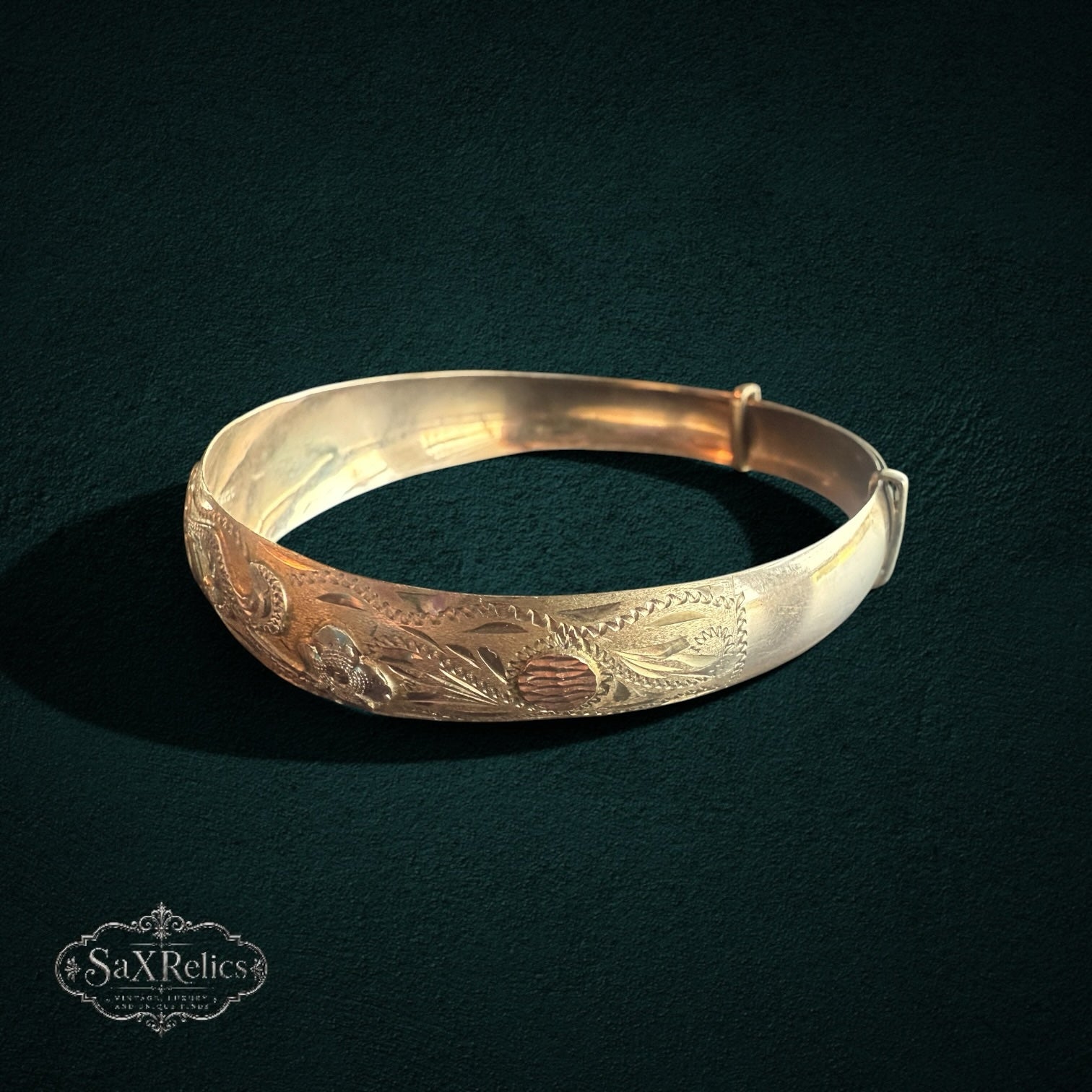 My Store vintage-inspired gold expandable bangle bracelet with intricate floral engraving and multi-tone finish.