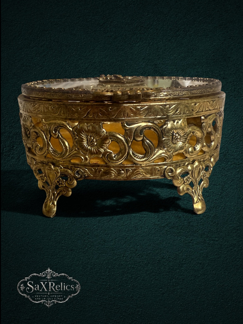 My Store vintage-style oval gold metal trinket box with intricate floral filigree and plush velvet interior lining.