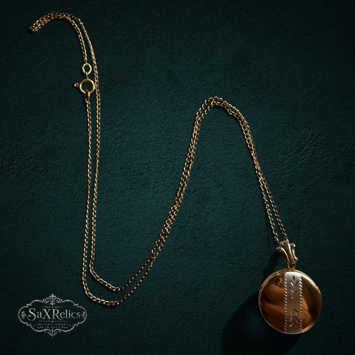 SaX Relics — Recuerdo 12K gold fill locket on its fine chain, shown full length.