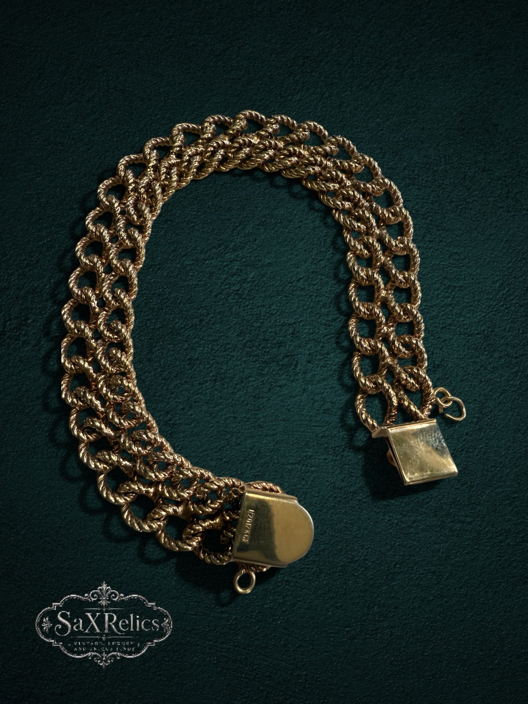 My Store SAXRelics vintage gold-filled multi-strand rope chain bracelet with a secure clasp on a dark green background.