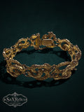 My Store vintage gold-tone serpent link bracelet with intricate textured snake motifs and a secure box clasp.