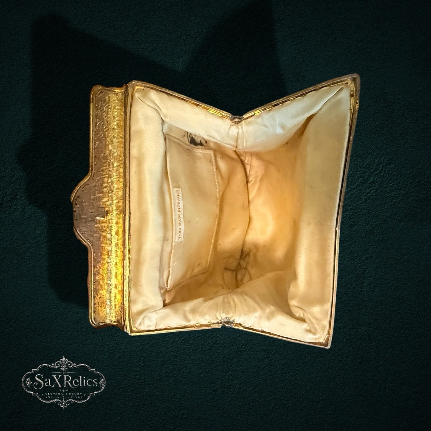 My Store vintage French evening handbag interior with cream fabric lining and gold-tone metal frame