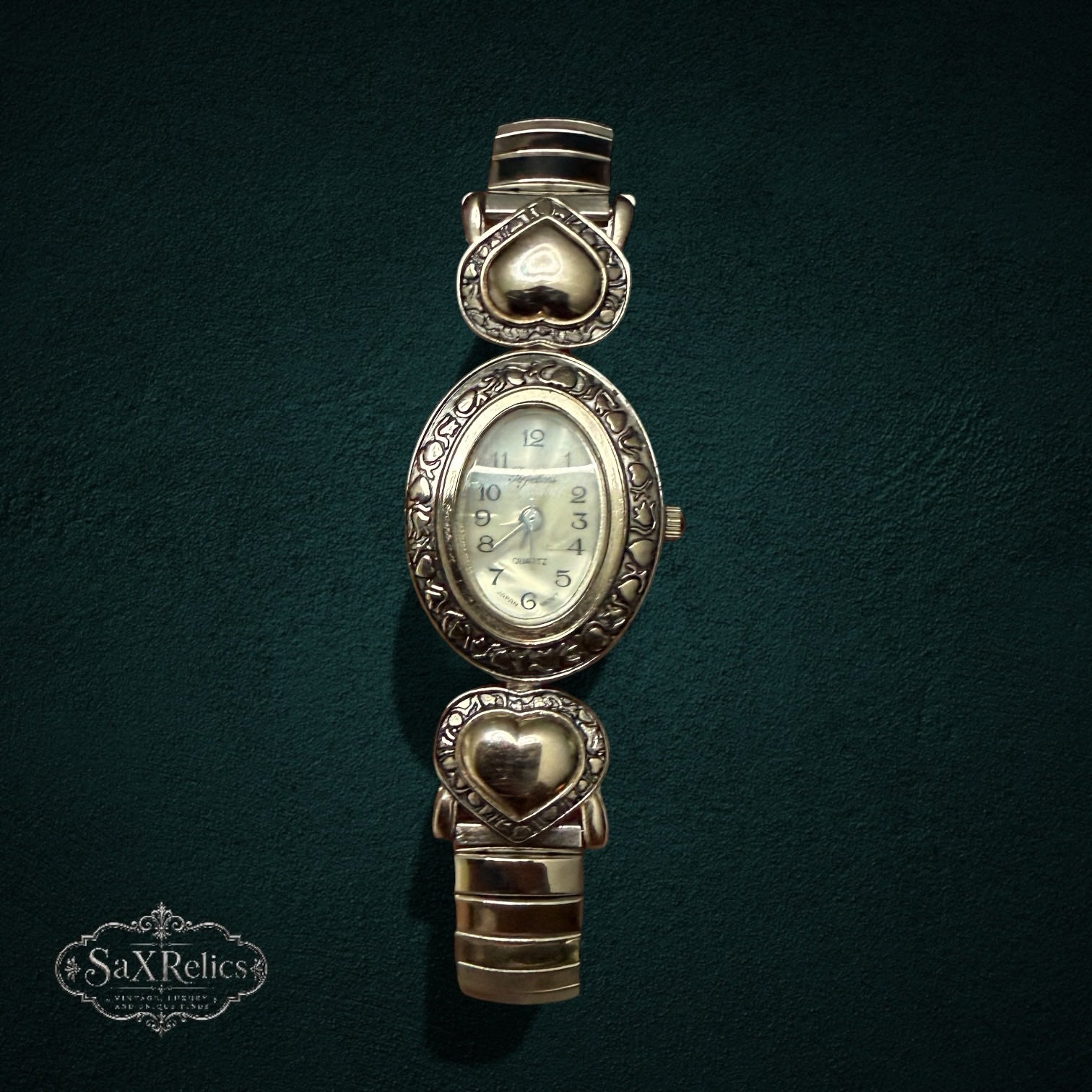 My Store vintage-inspired gold-tone quartz watch with an oval mother-of-pearl dial and heart-shaped expansion band links.
