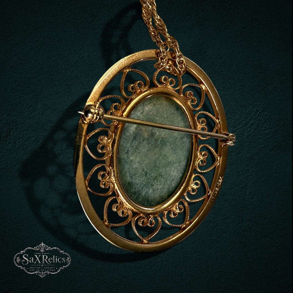 My Store vintage filigree pendant and brooch featuring a polished green jade stone in an ornate 12k gold-filled frame.
