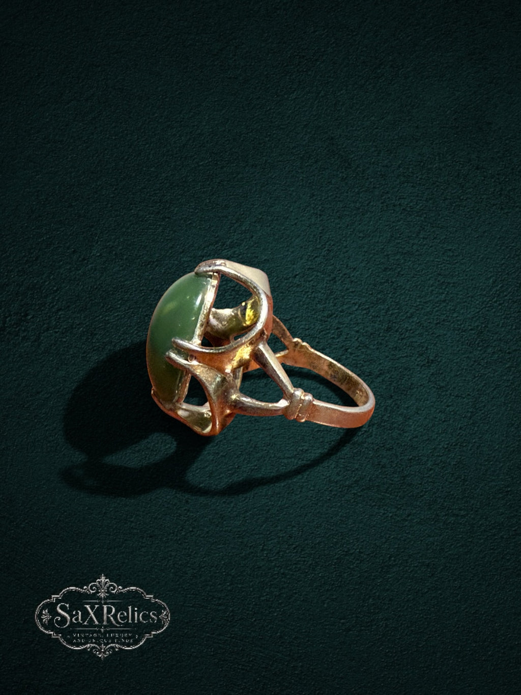My Store vintage SaxRelics statement ring featuring a polished green jade cabochon in a sculptural gold-tone setting.