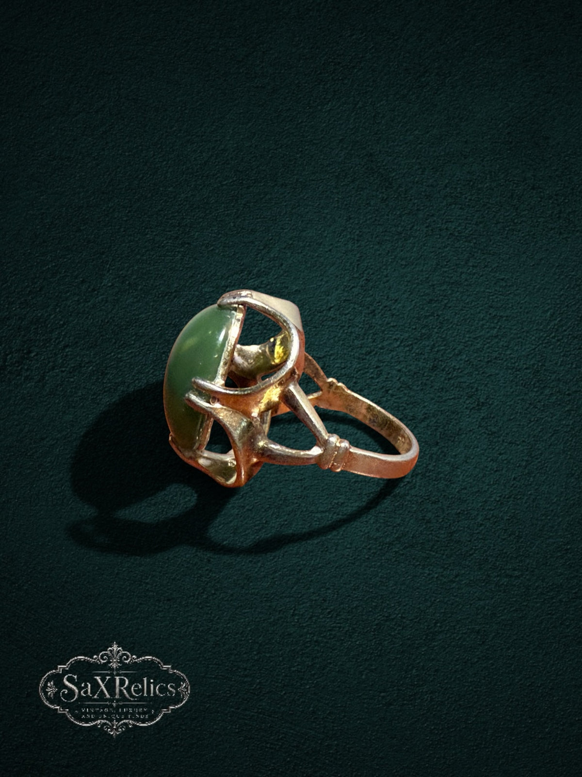 My Store vintage SaxRelics statement ring featuring a polished green jade cabochon in a sculptural gold-tone setting.