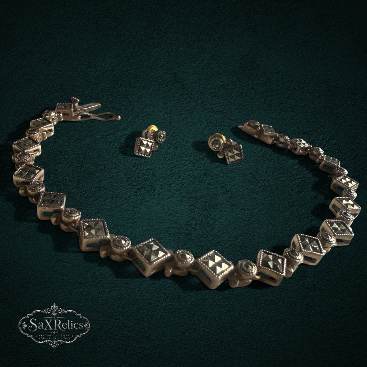 SaX Relics — Rocío vintage sterling silver and marcasite bracelet and earring set on a dark teal backdrop.