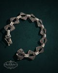 My Store vintage sterling silver bracelet featuring geometric triangular links with shimmering pavé-set marcasite stones.