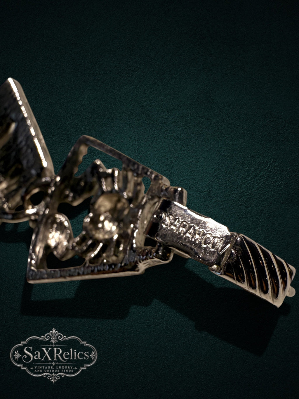 Vintage silver-tone link bracelet featuring detailed theatrical mask and crab motifs with a secure clasp