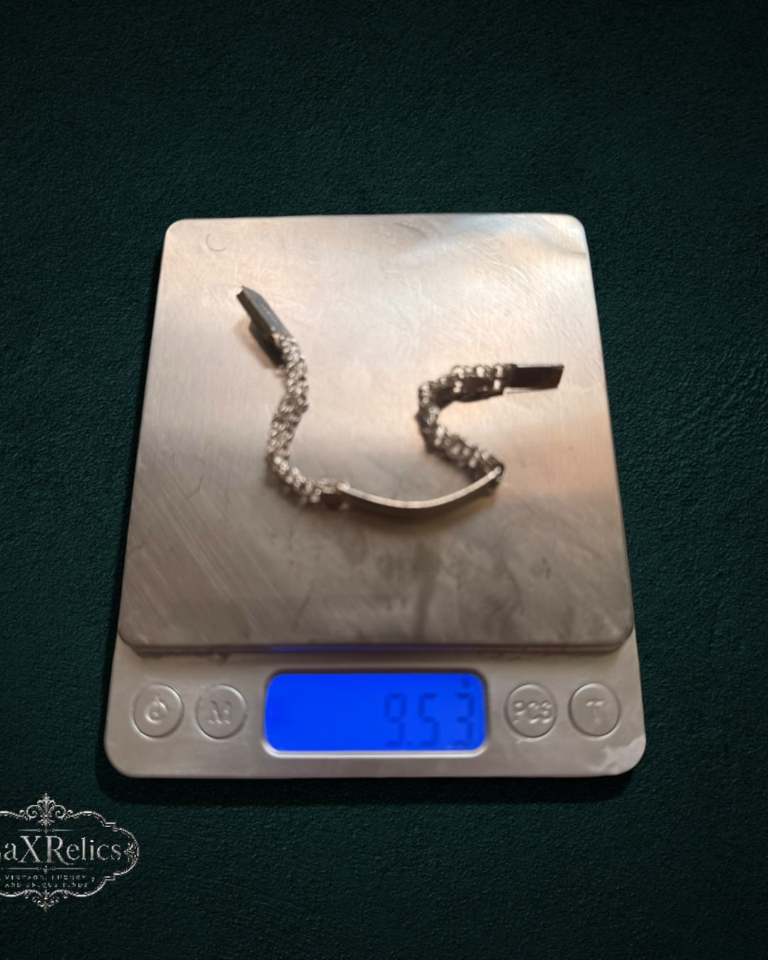 My Store vintage decorative metal ID link bracelet resting on a digital scale showing a weight of 9.53 grams.