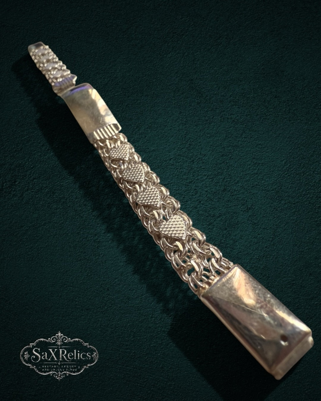 My Store vintage-inspired metal ID bracelet with intricate textured link patterns and a polished identification plate.