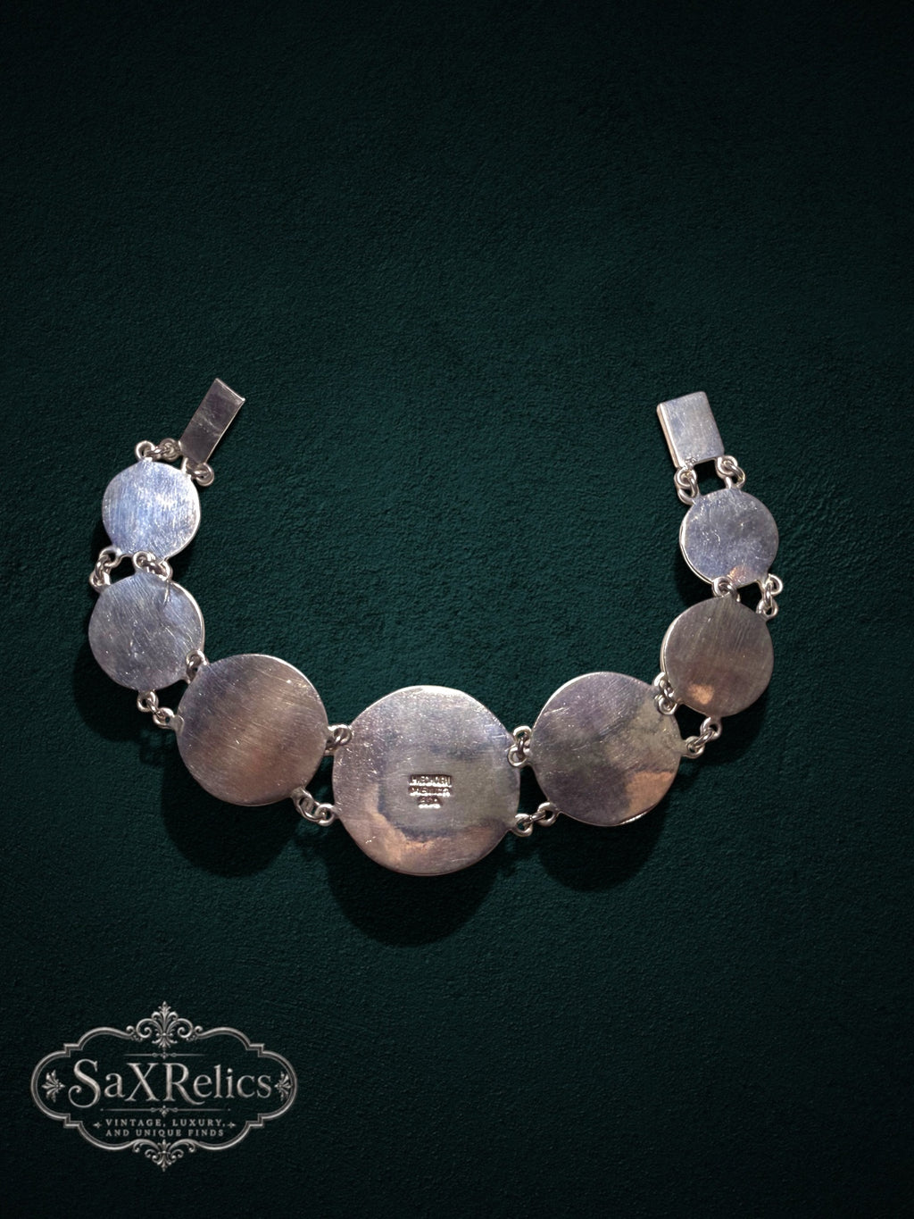 Mexica Mexican .950 silver Aztec calendar link bracelet on dark green