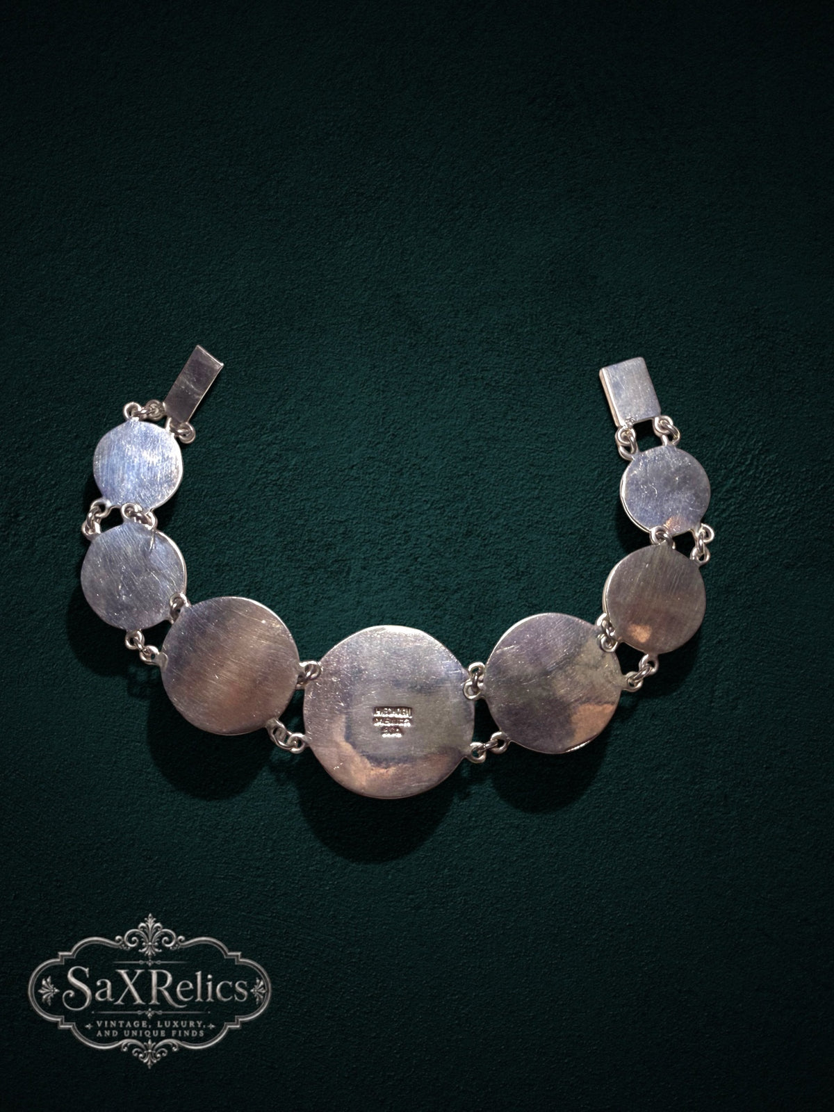 Mexica Mexican .950 silver Aztec calendar link bracelet on dark green