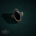 My Store vintage style sterling silver ring featuring an elongated black onyx stone and intricate marcasite detailing.