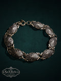 My Store vintage-inspired link bracelet featuring intricately embossed oval links in an antique silver-tone finish.