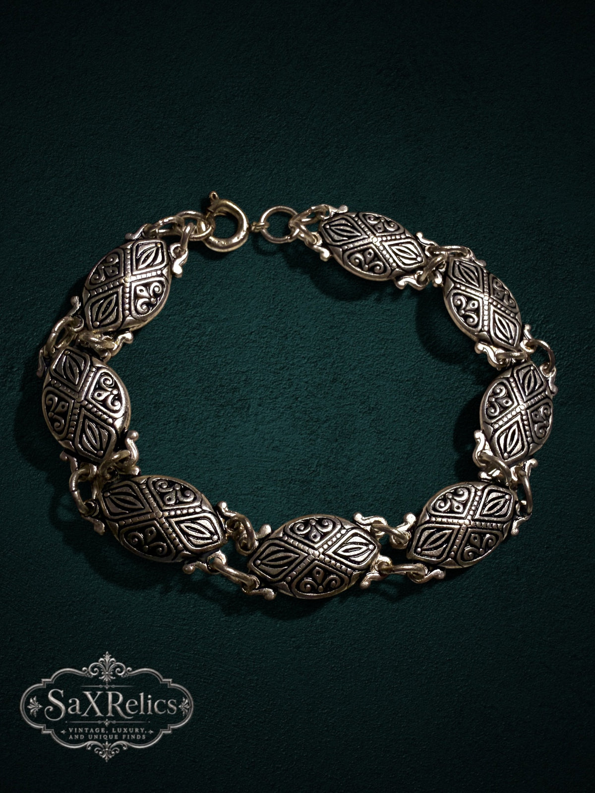 My Store vintage-inspired link bracelet featuring intricately embossed oval links in an antique silver-tone finish.
