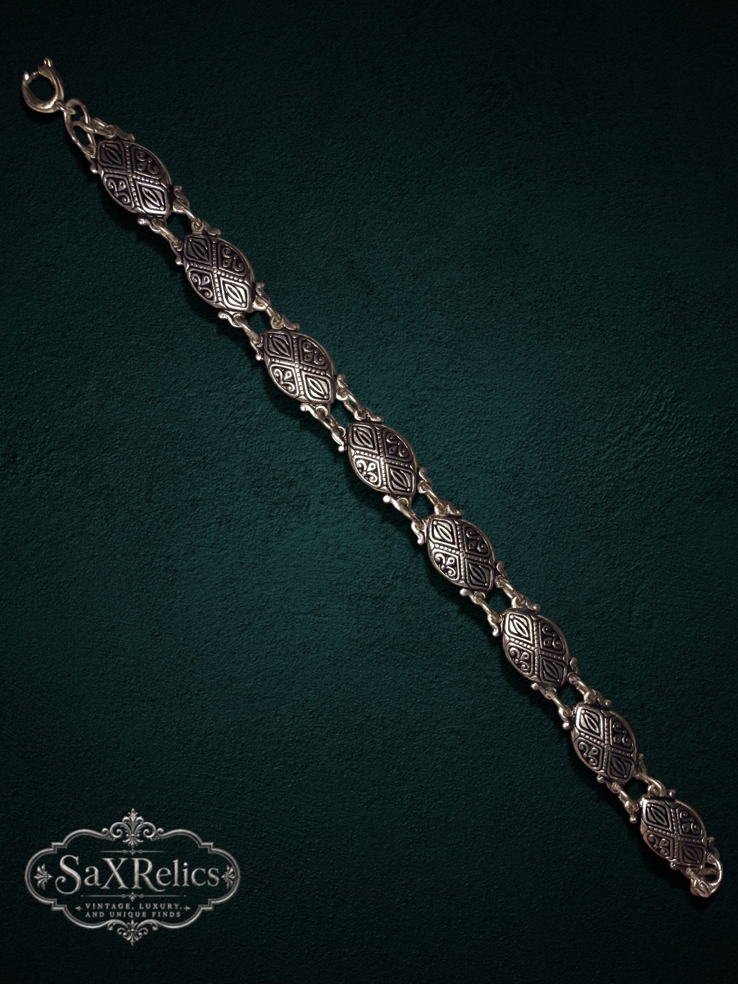 My Store SAXRelics vintage-inspired link bracelet with intricately embossed oval links in an antique silver-tone finish.