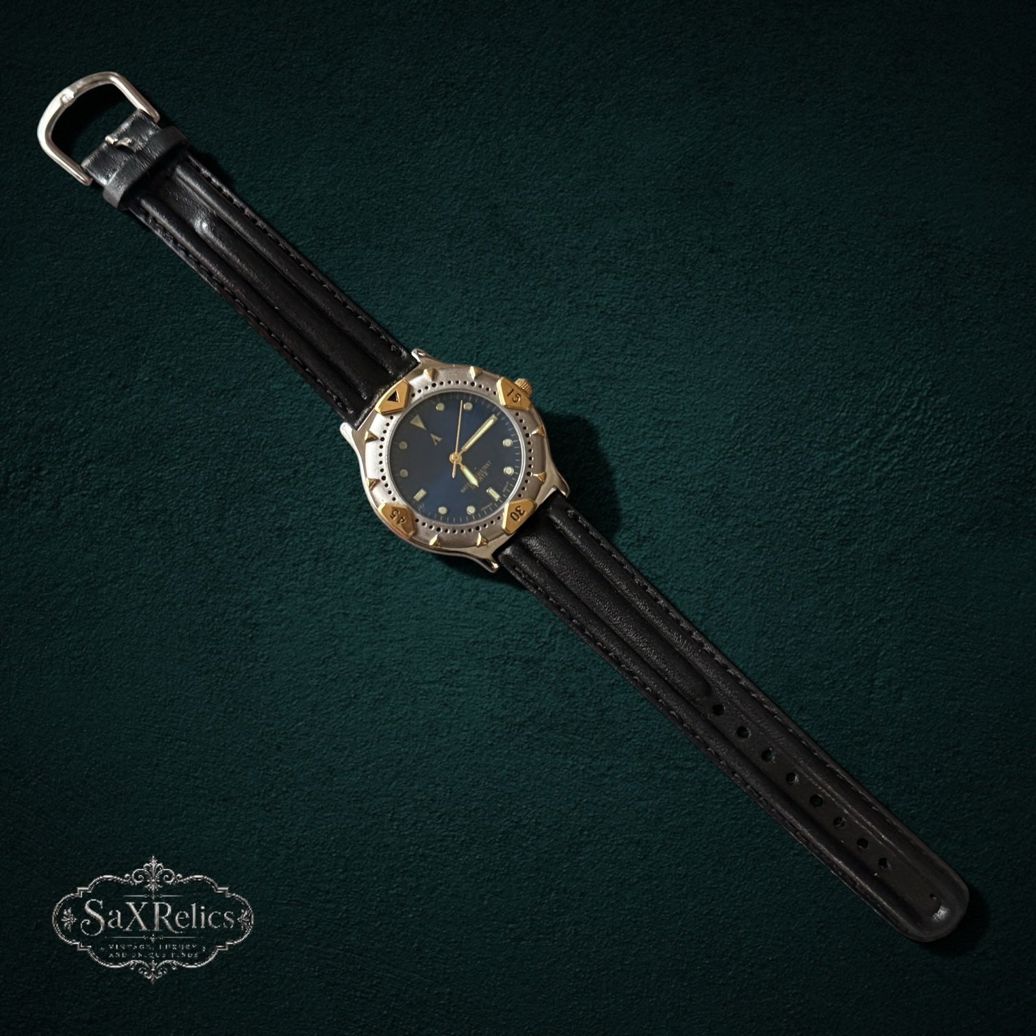 My Store vintage-inspired quartz wristwatch with a deep blue dial, two-tone silver and gold case, and black leather strap