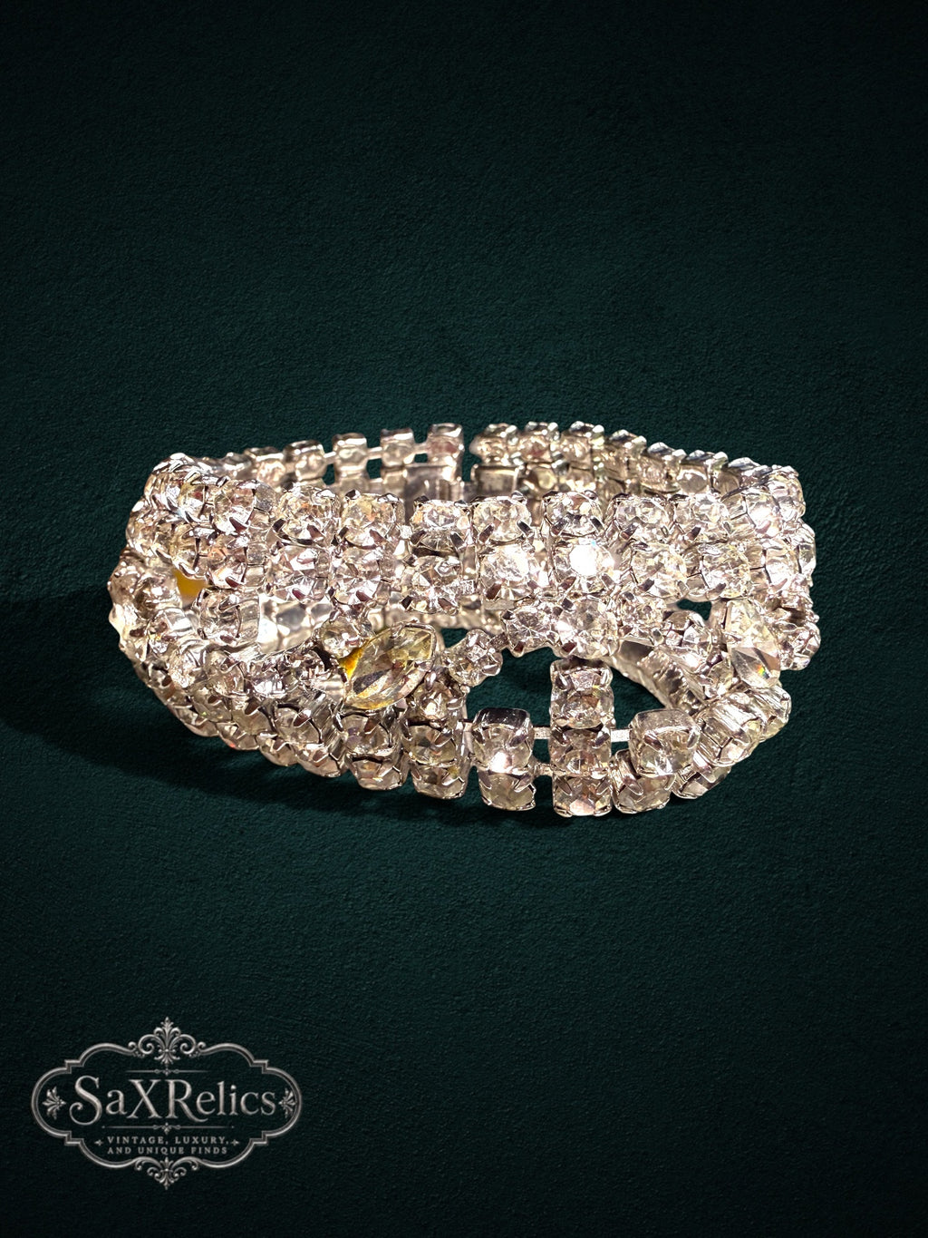 Vintage-inspired wide cuff bracelet featuring rows of clear rhinestones and marquise-cut crystals in silver.