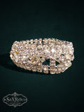 Vintage-inspired wide cuff bracelet featuring rows of clear rhinestones and marquise-cut crystals in silver.