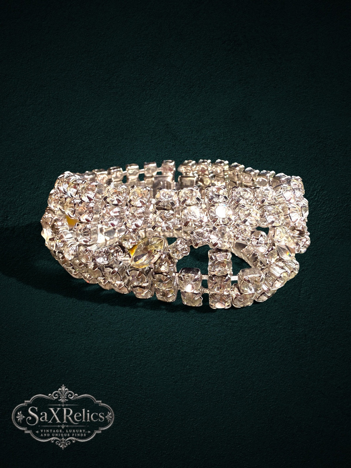Vintage-inspired wide cuff bracelet featuring rows of clear rhinestones and marquise-cut crystals in silver.