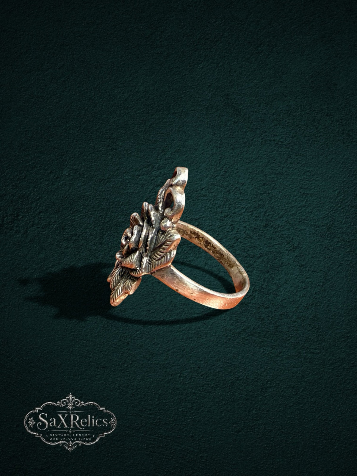 My Store vintage-inspired rose statement ring with intricate floral petals and leaves in a warm metallic finish.