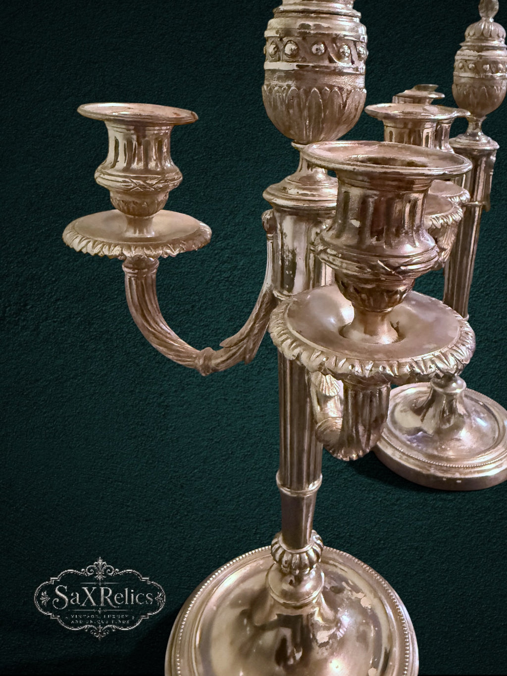 My Store vintage silver-plated three-light candelabra set with ornate fluted stems and intricate decorative details.