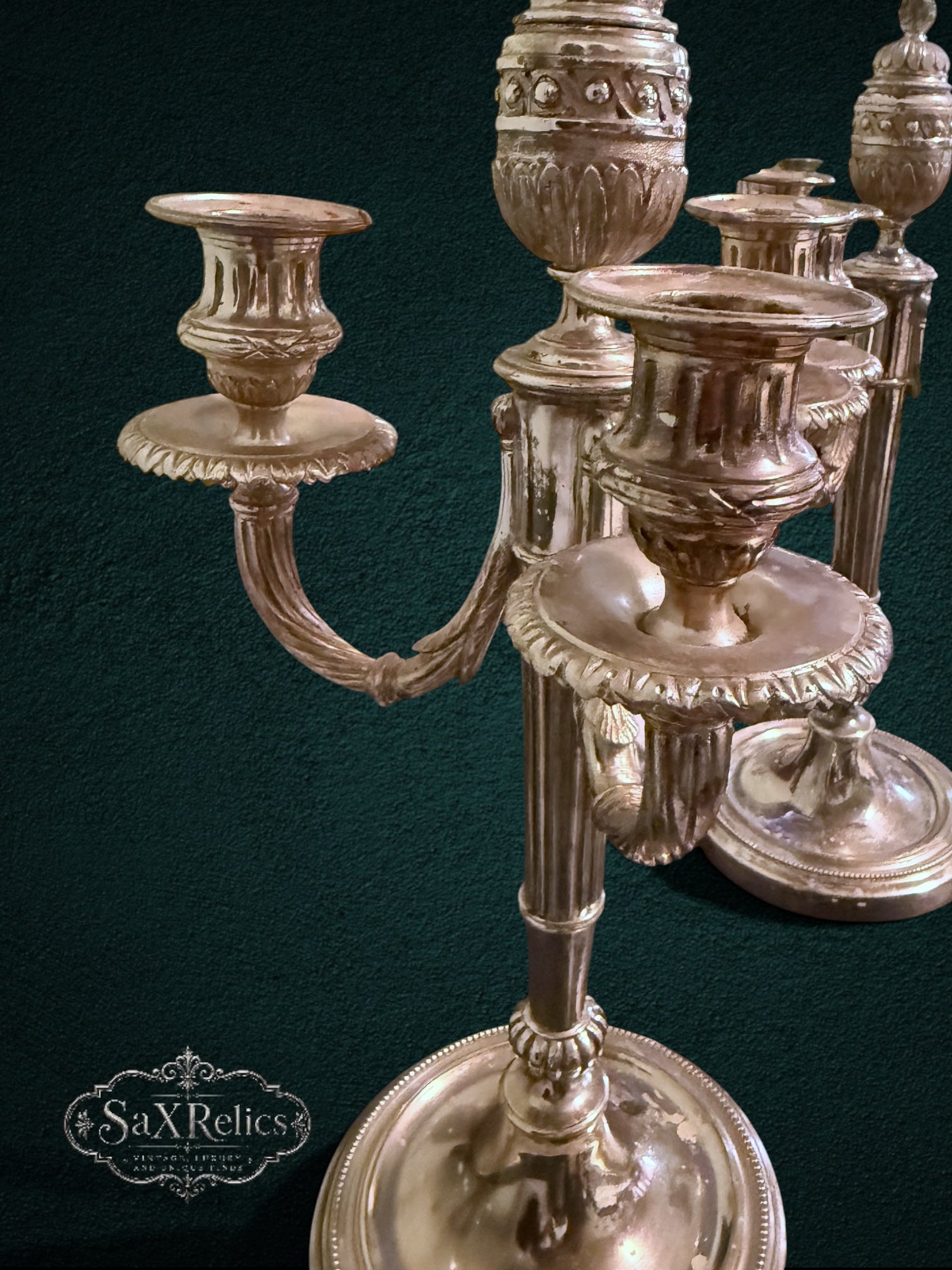 My Store vintage silver-plated three-light candelabra set with ornate fluted stems and intricate decorative details.