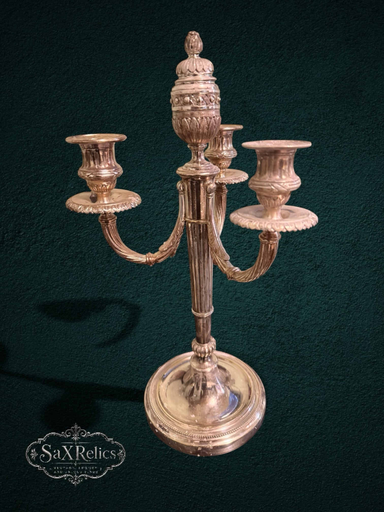 My Store vintage silver-plated three-light candelabra with ornate fluted stem and intricate decorative detailing.