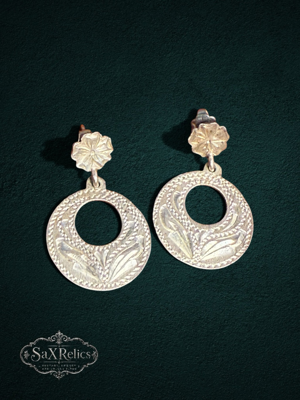 My Store vintage Mexican sterling silver drop earrings featuring circular designs with intricate floral engravings.