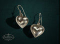 My Store vintage-inspired silver heart drop earrings with delicate etched detailing on a dark textured background