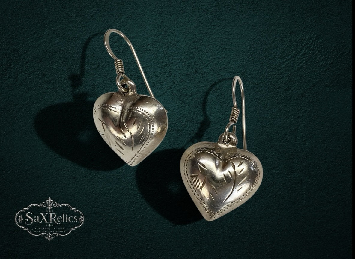 My Store vintage-inspired silver heart drop earrings with delicate etched detailing on a dark textured background