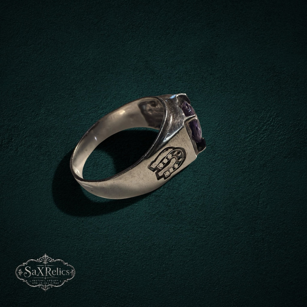My Store vintage 925 sterling silver ring featuring a purple stone and intricate horseshoe side motifs.