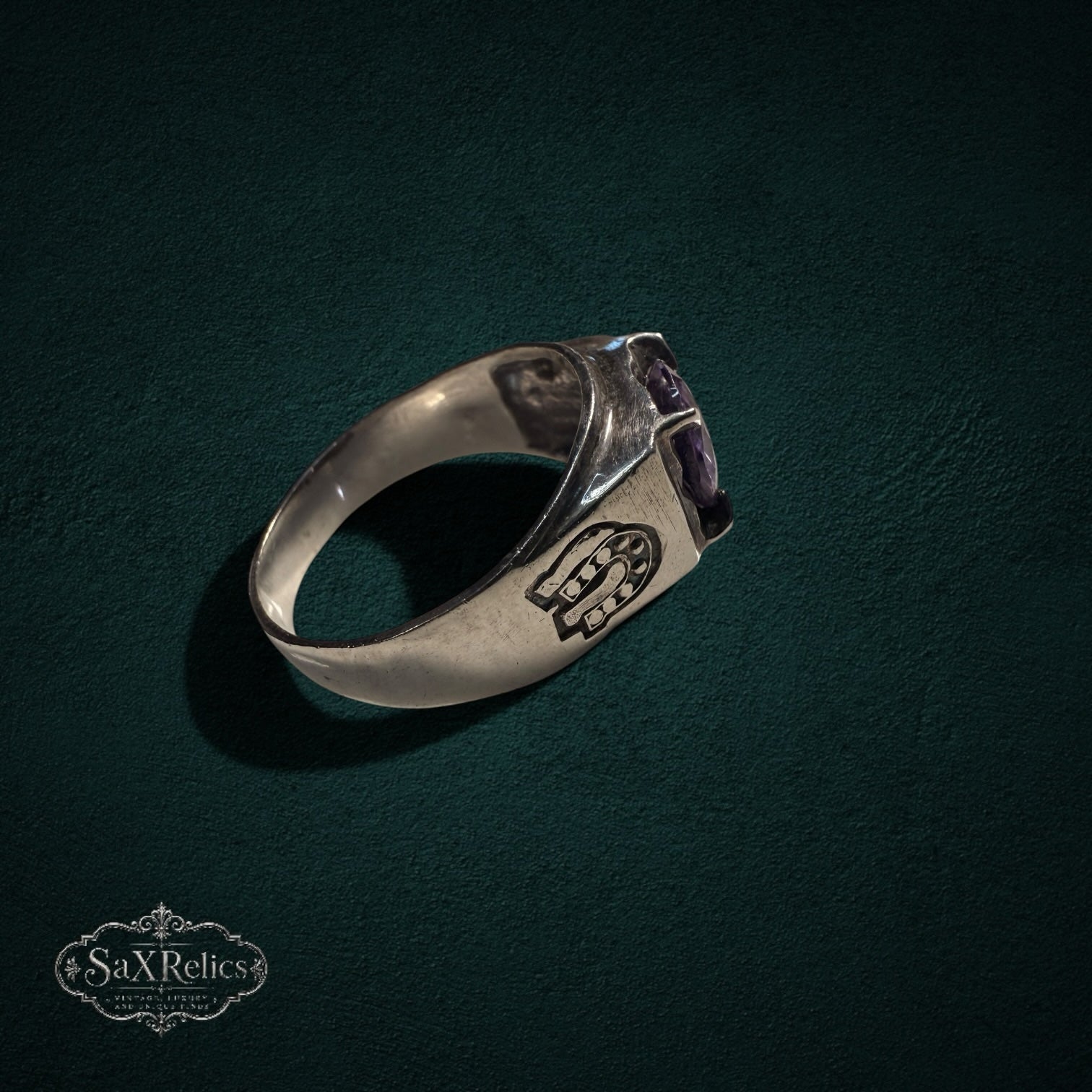 My Store vintage 925 sterling silver ring featuring a purple stone and intricate horseshoe side motifs.