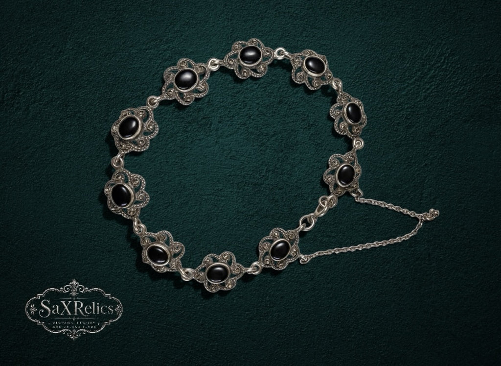 My Store SAXRelics vintage sterling silver link bracelet featuring ornate floral filigree and polished black onyx stones.