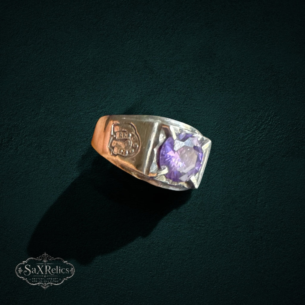 My Store vintage 925 sterling silver statement ring featuring a faceted purple stone and horseshoe side engravings.