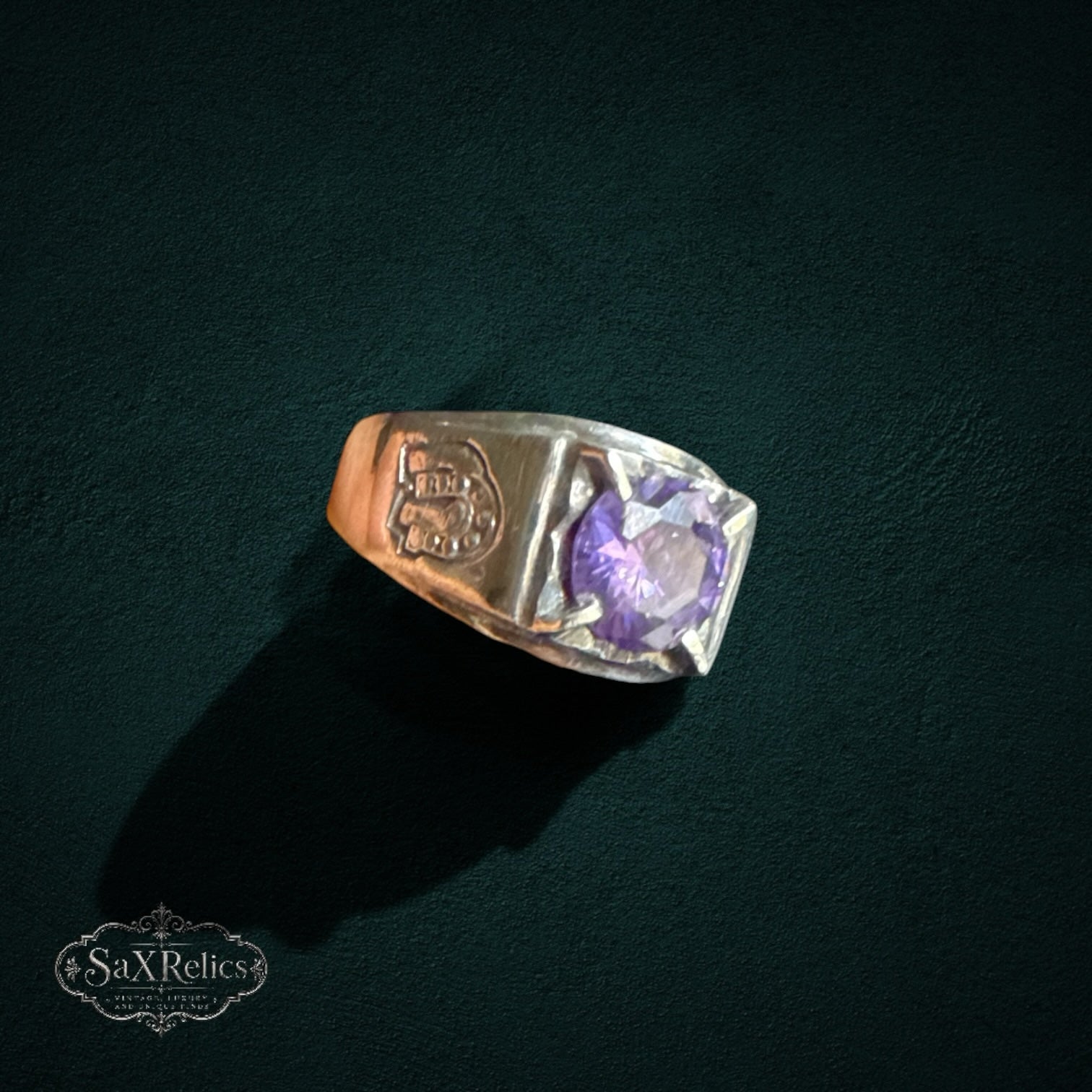 My Store vintage 925 sterling silver statement ring featuring a faceted purple stone and horseshoe side engravings.