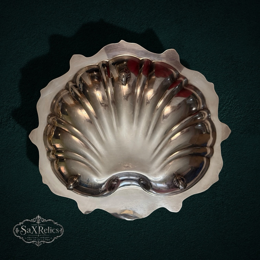 My Store vintage silver-plated scalloped shell serving dish with ornate border on a dark green background