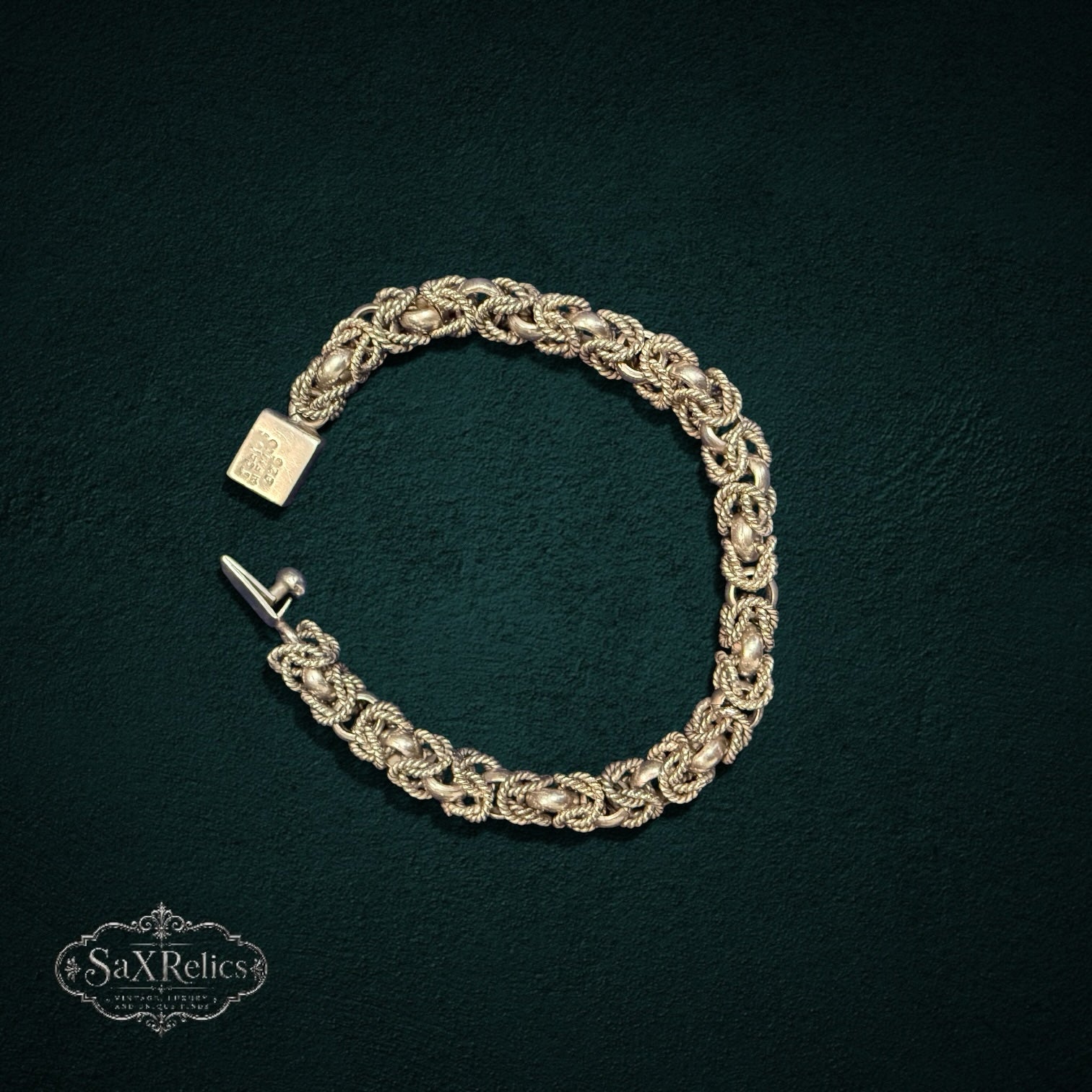 My Store vintage 925 sterling silver bracelet featuring an intricate woven rope-link design and a secure box clasp.