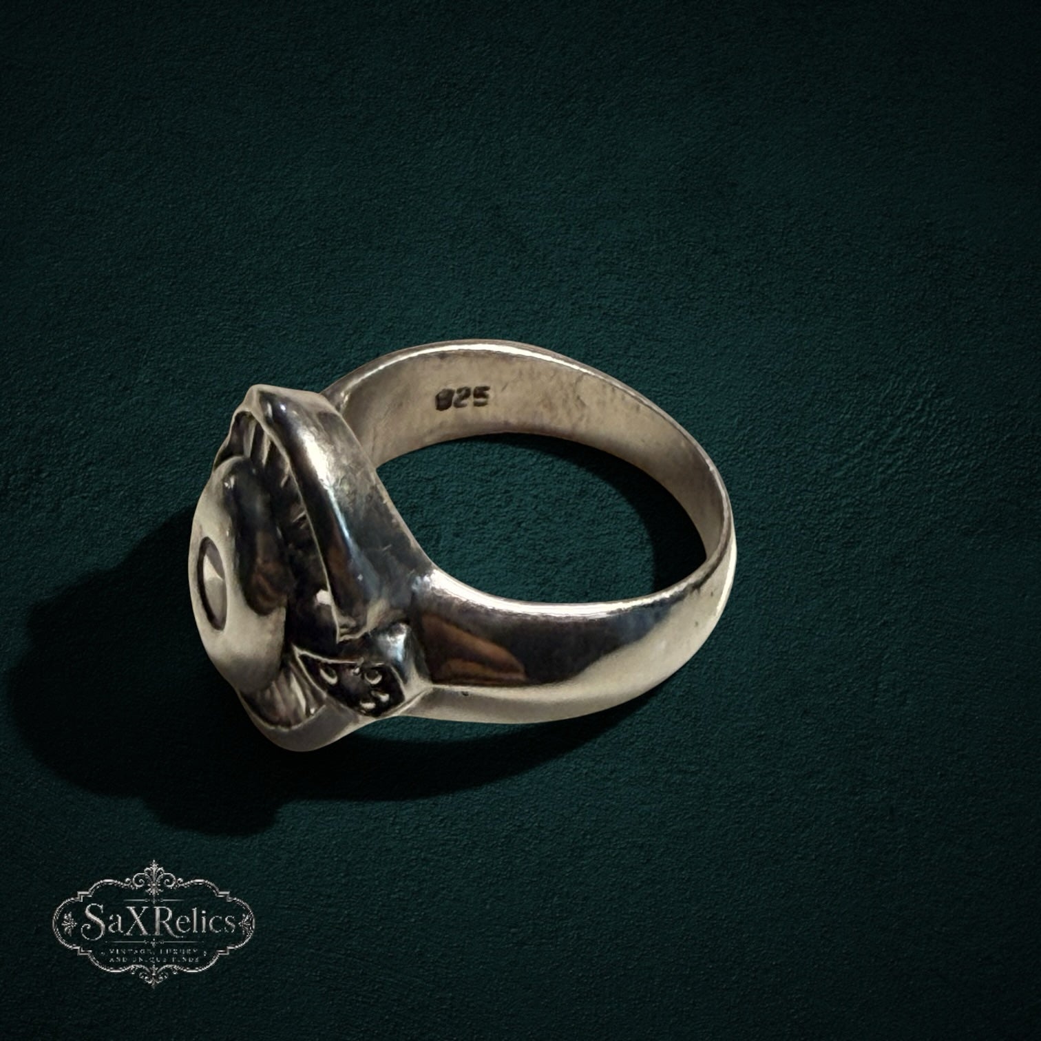My Store SAXRelics vintage style 925 sterling silver statement ring with circular centerpiece on dark background