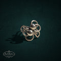 My Store SAXRelics vintage sterling silver statement ring featuring sculptural knotted wirework and polished spheres.