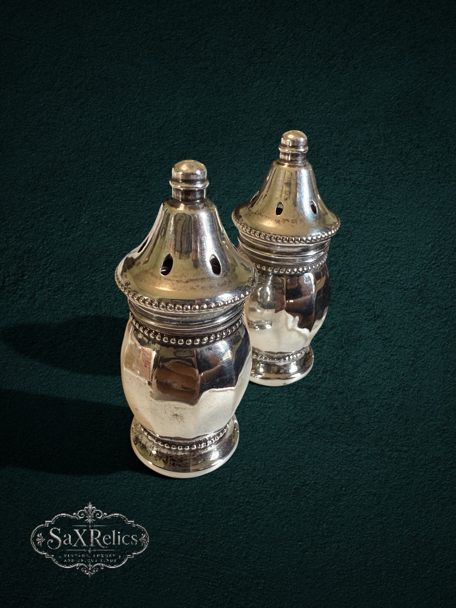 My Store vintage sterling silver salt and pepper shakers with polished finish and intricate beaded detailing.
