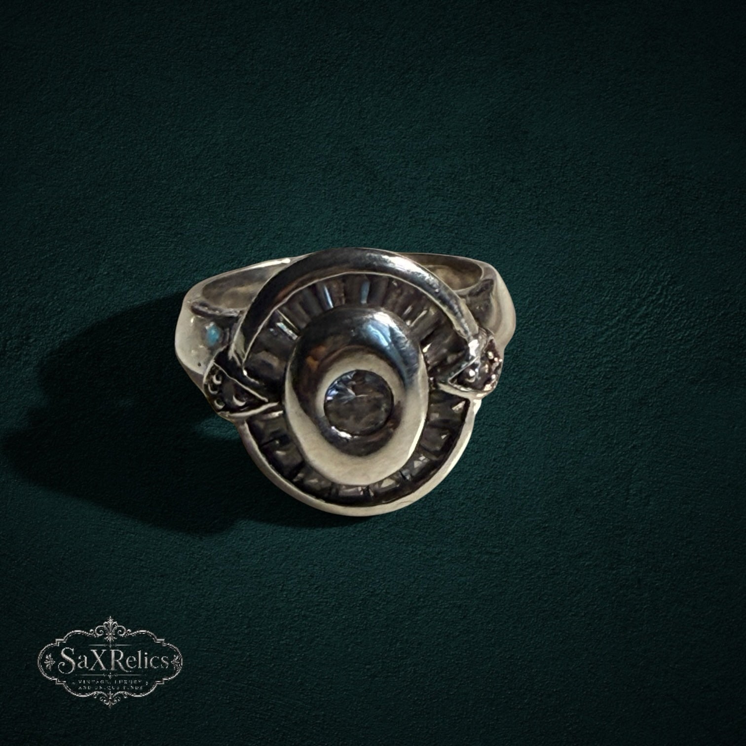My Store SAXRelics vintage-style 925 sterling silver statement ring with a circular halo and baguette-cut accents.