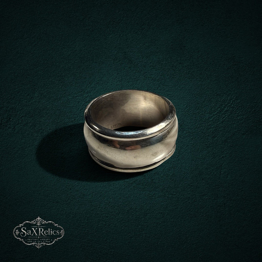 My Store vintage wide band ring in polished sterling silver with a smooth, curved architectural silhouette.