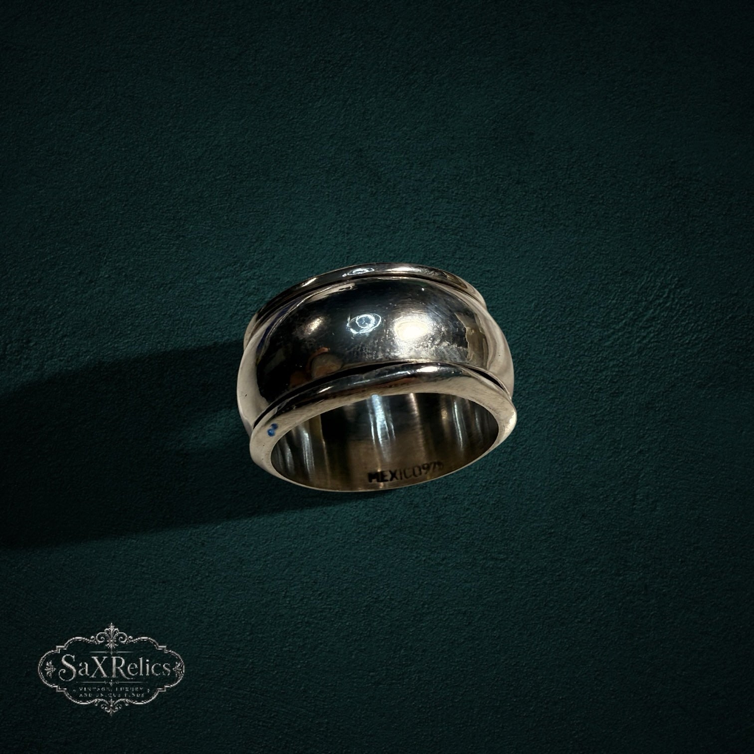 My Store vintage wide band ring in polished sterling silver with a smooth, curved silhouette and Mexico hallmark.