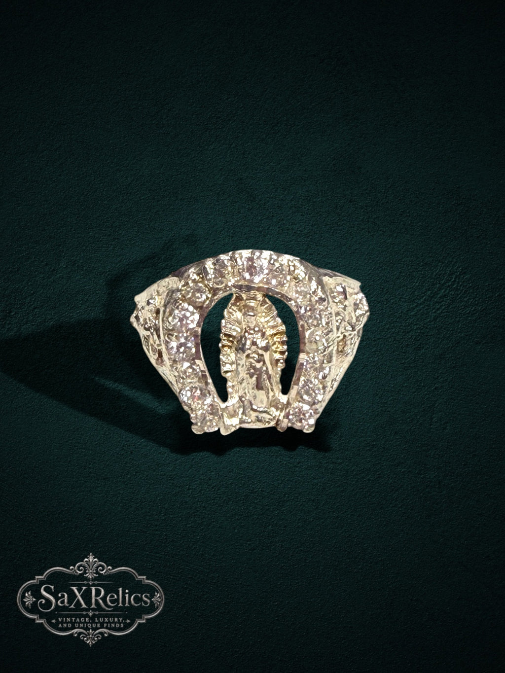 My Store SAXRelics religious ring featuring a Virgin Mary centerpiece in a horseshoe frame with sparkling stone accents.