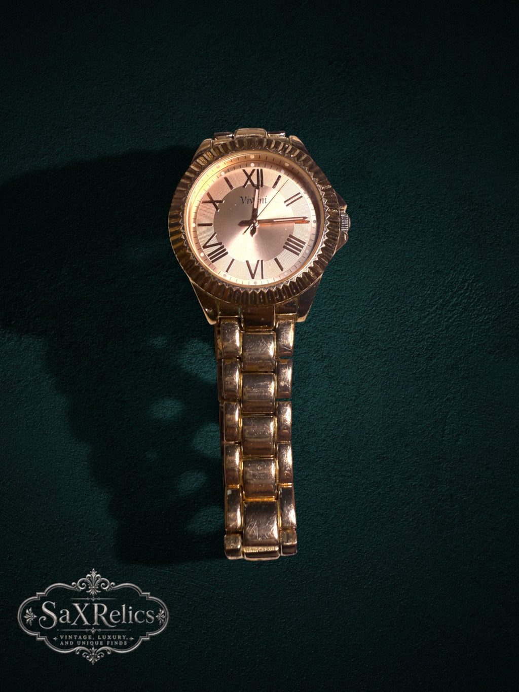 My Store Vivani gold-tone metal link wristwatch with a fluted bezel and Roman numeral dial on a dark green background.
